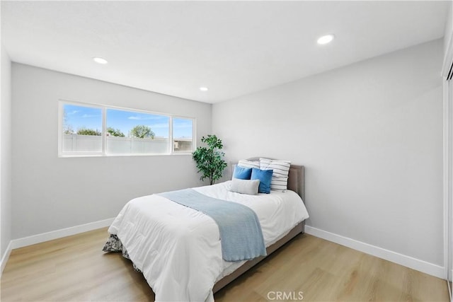 1608 E Helmick St, Carson, CA 90746 - bedroom with light wood finished floors, baseboards, and recessed lighting