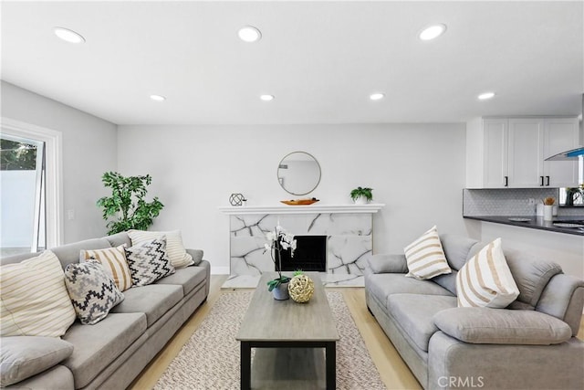 1608 E Helmick St, Carson, CA 90746 - living room with light wood finished floors, recessed lighting, and a premium fireplace
