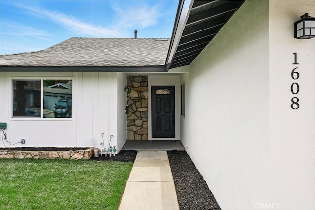 1608 E Helmick St, Carson, CA 90746 - doorway to property featuring roof with shingles and a lawn