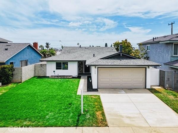 1608 E Helmick St, Carson, CA 90746 - view of front of house with driveway, an attached garage, and roof with shingles