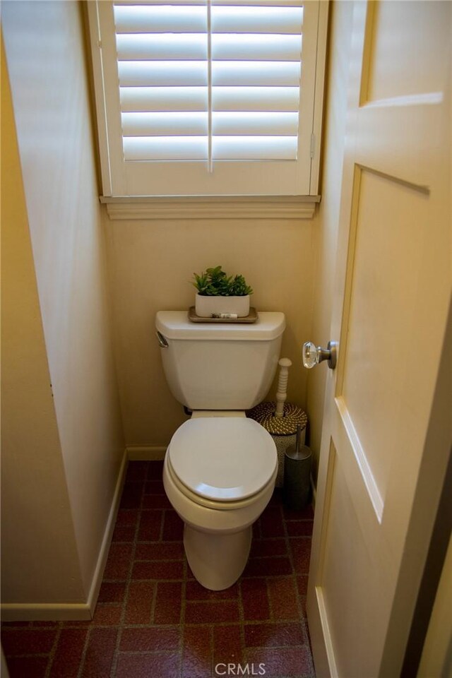2619 Mary St, La Crescenta, CA 91214 - bathroom with toilet, baseboards, and brick patterned floors