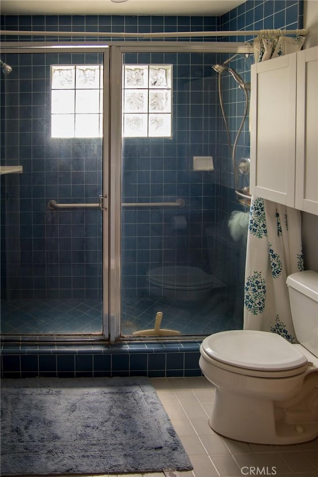 2619 Mary St, La Crescenta, CA 91214 - bathroom featuring toilet, tile patterned flooring, and a shower stall