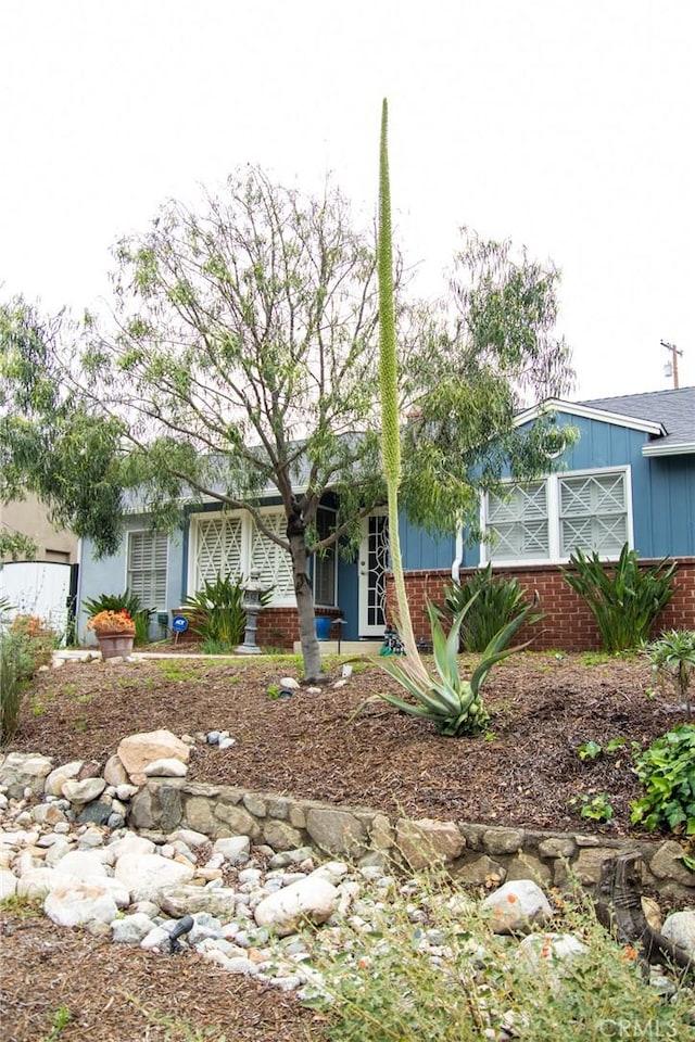 2619 Mary St, La Crescenta, CA 91214 - obstructed view of property featuring brick siding and board and batten siding
