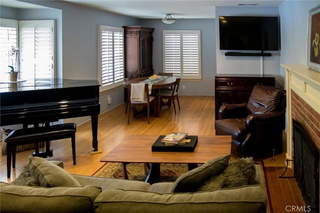 2619 Mary St, La Crescenta, CA 91214 - living room with a brick fireplace and wood finished floors