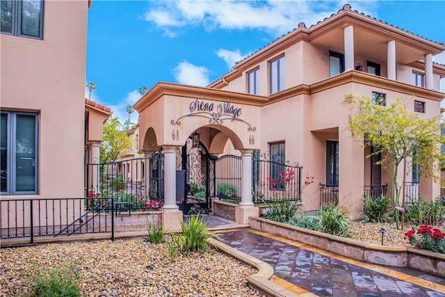 66 N Allen Ave Unit 3, Pasadena, CA 91106 - property entrance featuring stucco siding, fence, a gate, and a tile roof