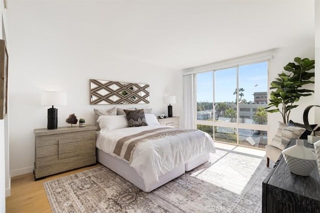 850 E Ocean Blvd Unit 602, Long Beach, CA 90802 - bedroom featuring light wood finished floors and baseboards