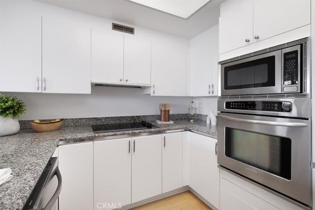 850 E Ocean Blvd Unit 602, Long Beach, CA 90802 - kitchen featuring appliances with stainless steel finishes, white cabinetry, and under cabinet range hood