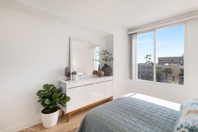 850 E Ocean Blvd Unit 602, Long Beach, CA 90802 - bedroom featuring baseboards and light wood-style flooring