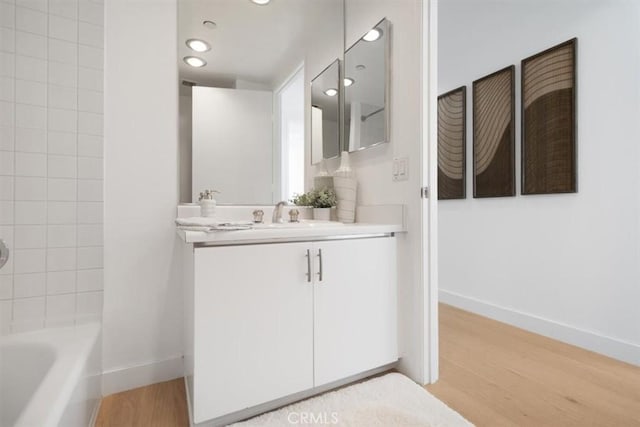 850 E Ocean Blvd Unit 602, Long Beach, CA 90802 - full bathroom with vanity, wood finished floors, recessed lighting, and tub / shower combination