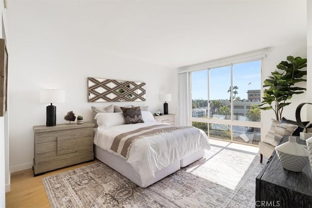 850 E Ocean Blvd Unit 602, Long Beach, CA 90802 - bedroom featuring light wood-type flooring and baseboards