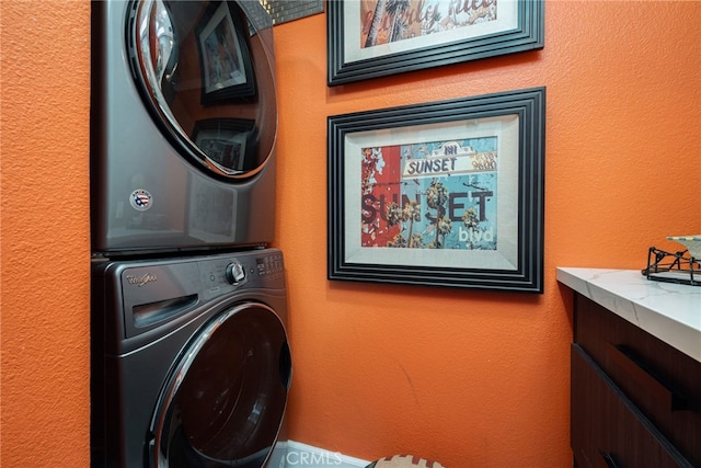washroom with stacked washer / drying machine