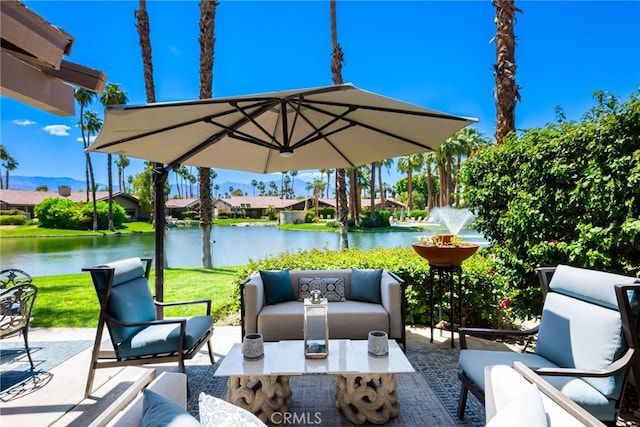 view of patio / terrace with outdoor lounge area and a water view