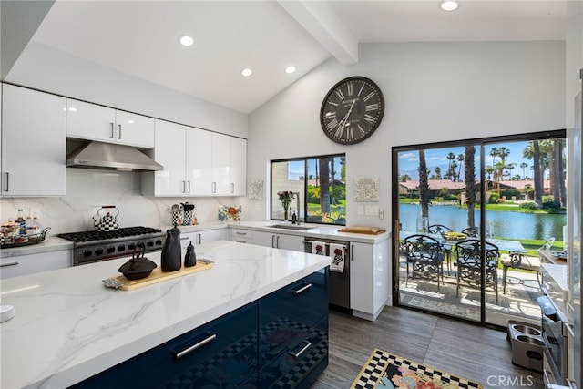 kitchen featuring under cabinet range hood, beamed ceiling, wood finished floors, stainless steel dishwasher, and high vaulted ceiling