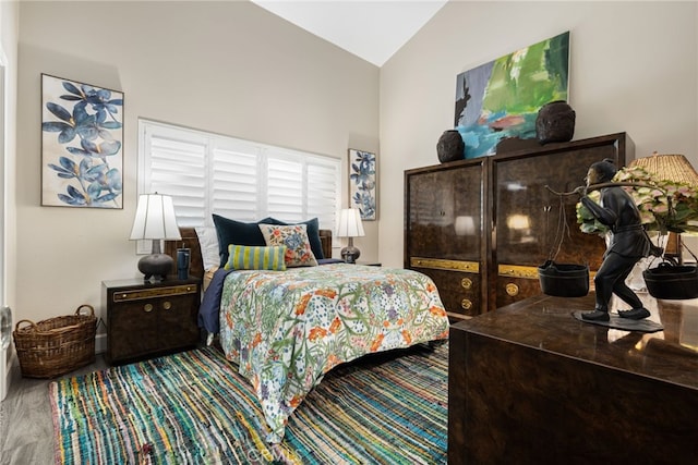 bedroom featuring high vaulted ceiling