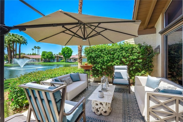 view of patio / terrace featuring a water view and an outdoor hangout area