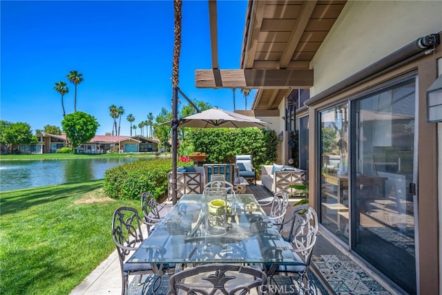 view of patio / terrace featuring outdoor dining space and a water view