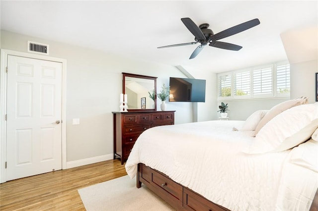 17301 Elsinore Cir, Huntington Beach, CA 92647 - bedroom with light wood finished floors, baseboards, and ceiling fan