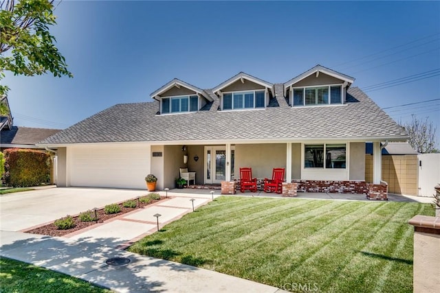 17301 Elsinore Cir, Huntington Beach, CA 92647 - view of front of property featuring stucco siding, a shingled roof, covered porch, and a front yard