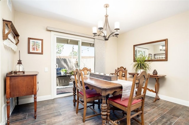17301 Elsinore Cir, Huntington Beach, CA 92647 - dining room featuring a chandelier, dark wood-style floors, and baseboards