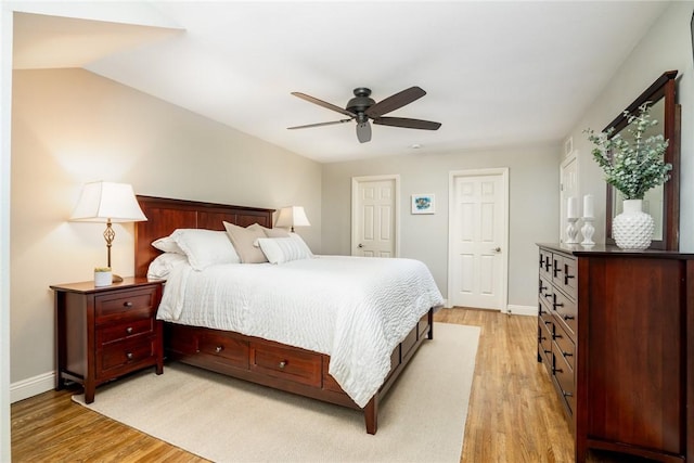 17301 Elsinore Cir, Huntington Beach, CA 92647 - bedroom with light wood-style flooring, baseboards, and ceiling fan