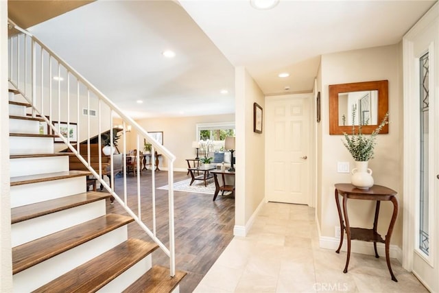 17301 Elsinore Cir, Huntington Beach, CA 92647 - entrance foyer featuring stairway, recessed lighting, and baseboards
