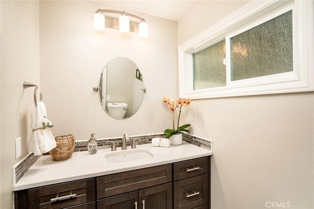 17301 Elsinore Cir, Huntington Beach, CA 92647 - bathroom featuring vanity and backsplash