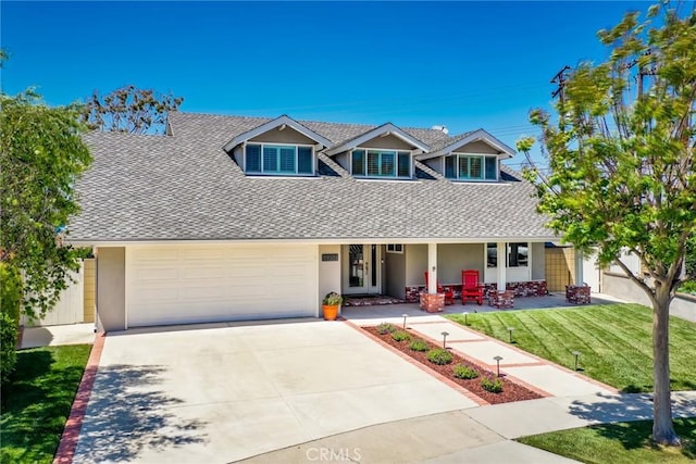 17301 Elsinore Cir, Huntington Beach, CA 92647 - view of front of property featuring a shingled roof, a front yard, concrete driveway, covered porch, and stucco siding