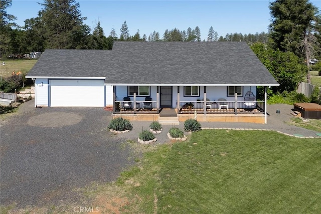 6151 N Libby Rd, Paradise, CA 95969 - view of front of home with covered porch, an attached garage, a front lawn, driveway, and a shingled roof