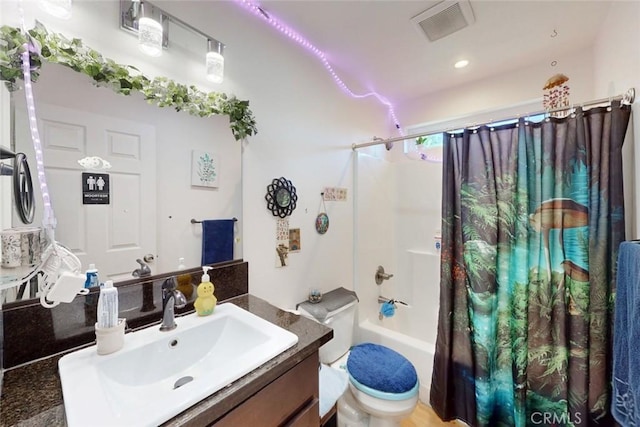 6151 N Libby Rd, Paradise, CA 95969 - bathroom featuring vanity, shower / tub combo with curtain, and toilet