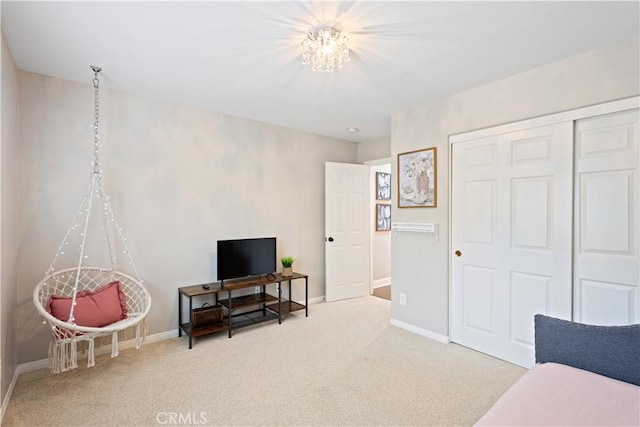 living area featuring carpet floors and baseboards