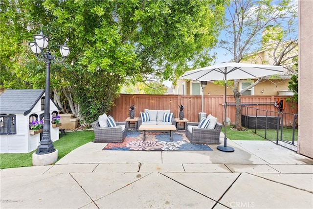 view of patio / terrace with an outdoor living space and a fenced backyard