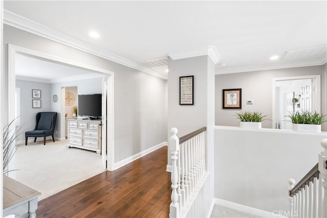 corridor with an upstairs landing, baseboards, crown molding, wood finished floors, and recessed lighting