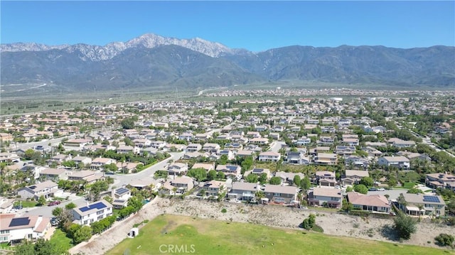 aerial view of residential area featuring mountains