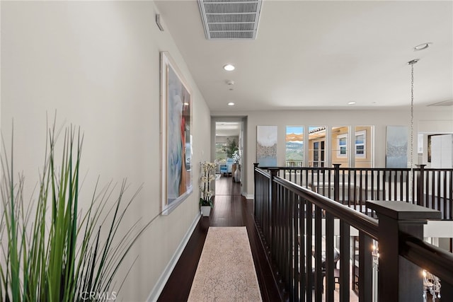 7051 Sitio Caliente, Carlsbad, CA 92009 - hallway with wood finished floors, recessed lighting, an upstairs landing, and baseboards