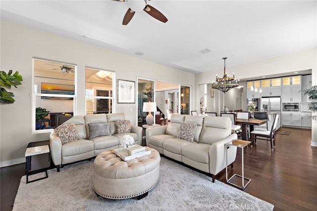 7051 Sitio Caliente, Carlsbad, CA 92009 - living room with a ceiling fan, a chandelier, and dark wood finished floors