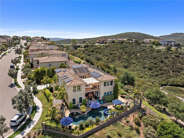 7051 Sitio Caliente, Carlsbad, CA 92009 - aerial view of property and surrounding area featuring mountains and a pool area