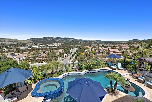 7051 Sitio Caliente, Carlsbad, CA 92009 - view of pool featuring a mountain view, a patio area, a residential view, and a pool with connected hot tub
