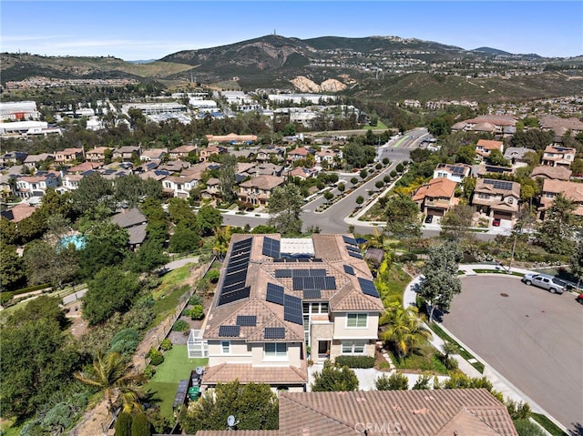 7051 Sitio Caliente, Carlsbad, CA 92009 - aerial view of property and surrounding area with mountains and nearby suburban area