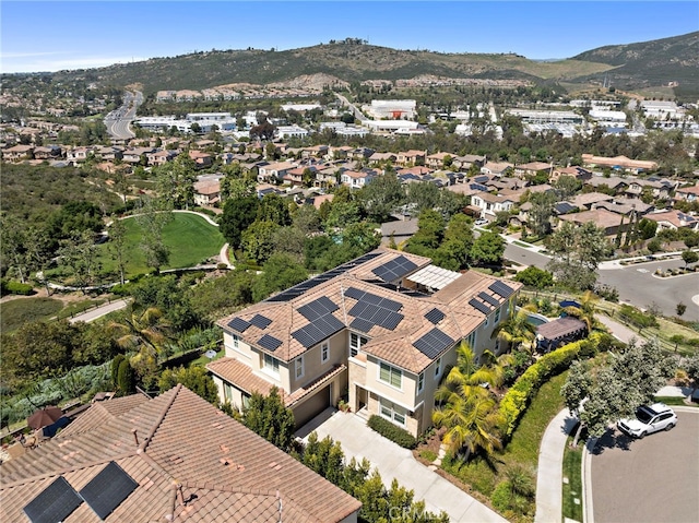 7051 Sitio Caliente, Carlsbad, CA 92009 - aerial perspective of suburban area with a mountainous background