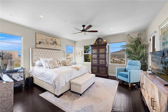 7051 Sitio Caliente, Carlsbad, CA 92009 - bedroom with multiple windows, dark wood-style floors, recessed lighting, and ceiling fan