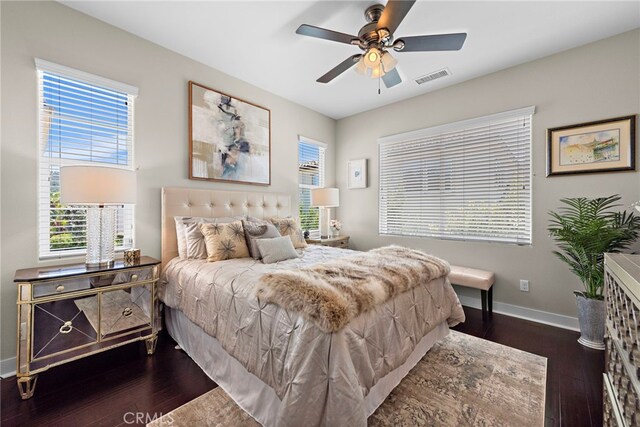 7051 Sitio Caliente, Carlsbad, CA 92009 - bedroom with dark wood-style floors, baseboards, and a ceiling fan