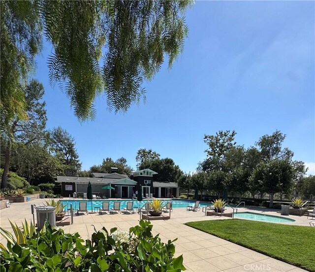 7051 Sitio Caliente, Carlsbad, CA 92009 - community pool with a patio area and a yard