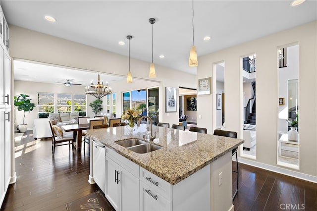 7051 Sitio Caliente, Carlsbad, CA 92009 - kitchen featuring open floor plan, dark wood-type flooring, an island with sink, dishwasher, and recessed lighting