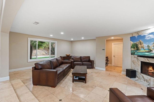 10845 Mystery Mountain Rd, Valley Center, CA 92082 - living room with a fireplace, arched walkways, recessed lighting, and baseboards