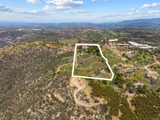 10845 Mystery Mountain Rd, Valley Center, CA 92082 - aerial overview of property's location featuring a mountainous background and property boundaries highlighted