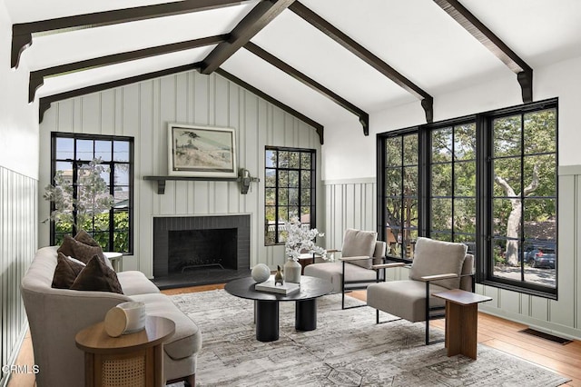 1858 Laurel Bay Dr, Pasadena, CA 91105 - living room with wood finished floors, a brick fireplace, and a decorative wall