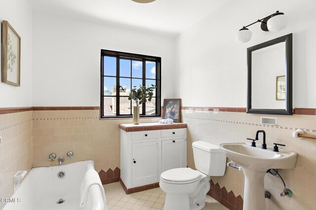 1858 Laurel Bay Dr, Pasadena, CA 91105 - full bathroom featuring tile walls, a bath, toilet, wainscoting, and tile patterned floors