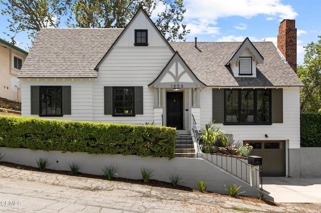1858 Laurel Bay Dr, Pasadena, CA 91105 - view of front of property with an attached garage, concrete driveway, roof with shingles, and a chimney