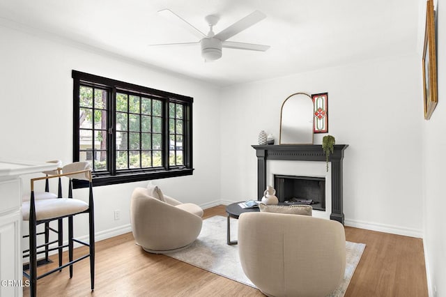 1858 Laurel Bay Dr, Pasadena, CA 91105 - living area featuring a ceiling fan, wood finished floors, a fireplace, baseboards, and ornamental molding