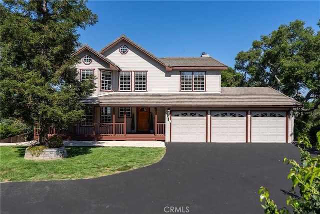 10885 San Marcos Rd, Atascadero, CA 93422 - view of front of property featuring covered porch, driveway, a tiled roof, an attached garage, and a chimney